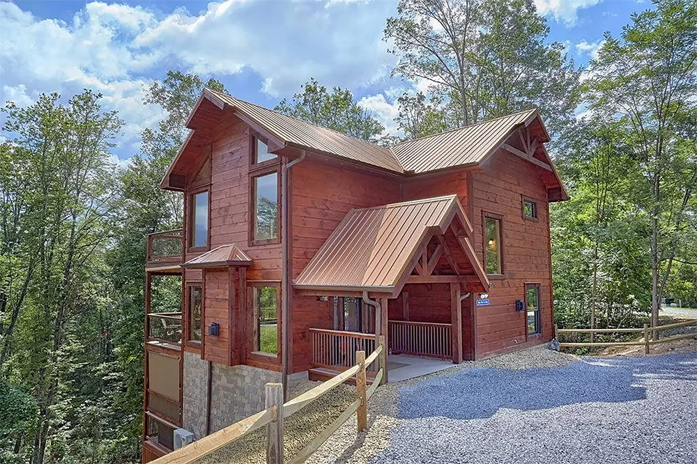Multi-level custom cabin with covered porch and mountain setting