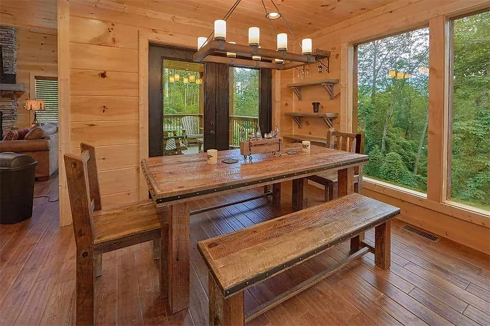 Dining area overlooking the Smoky Mountains with handcrafted wood finishes