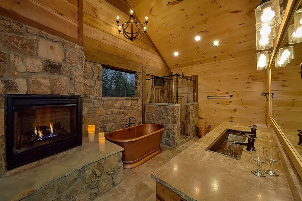 Living room featuring a floor-to-ceiling stone fireplace