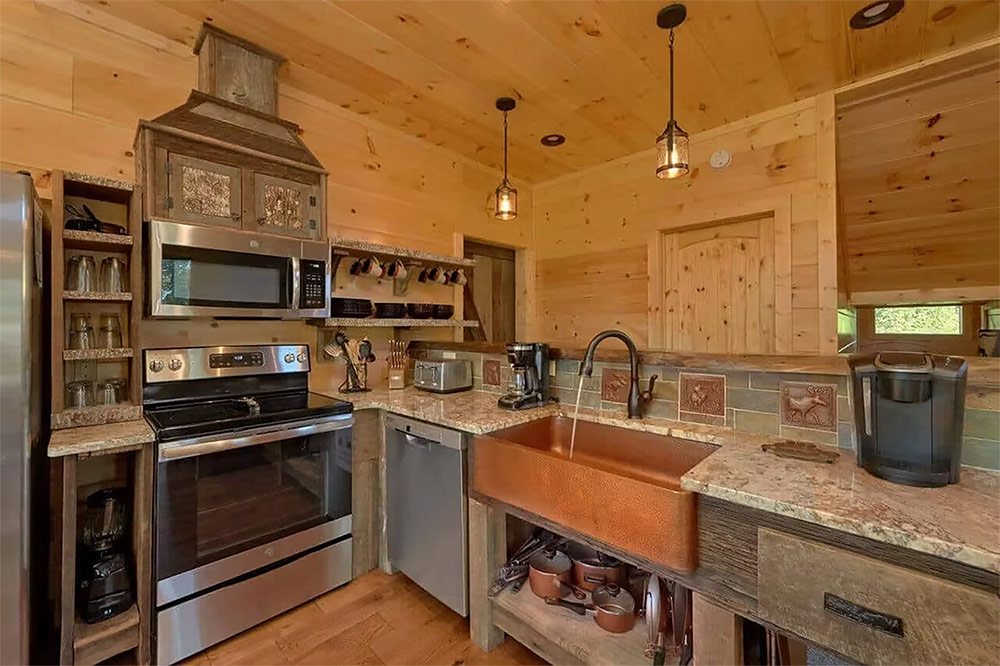 Gourmet kitchen with stainless appliances and custom cabinetry