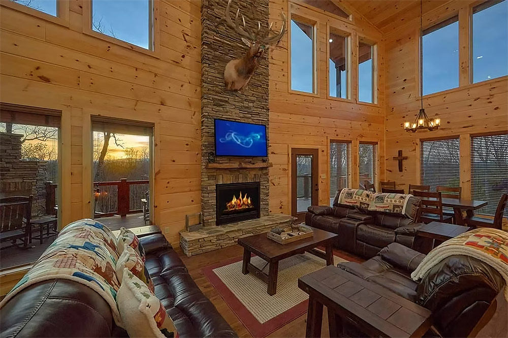 Open-concept living room with vaulted ceilings and mountain views