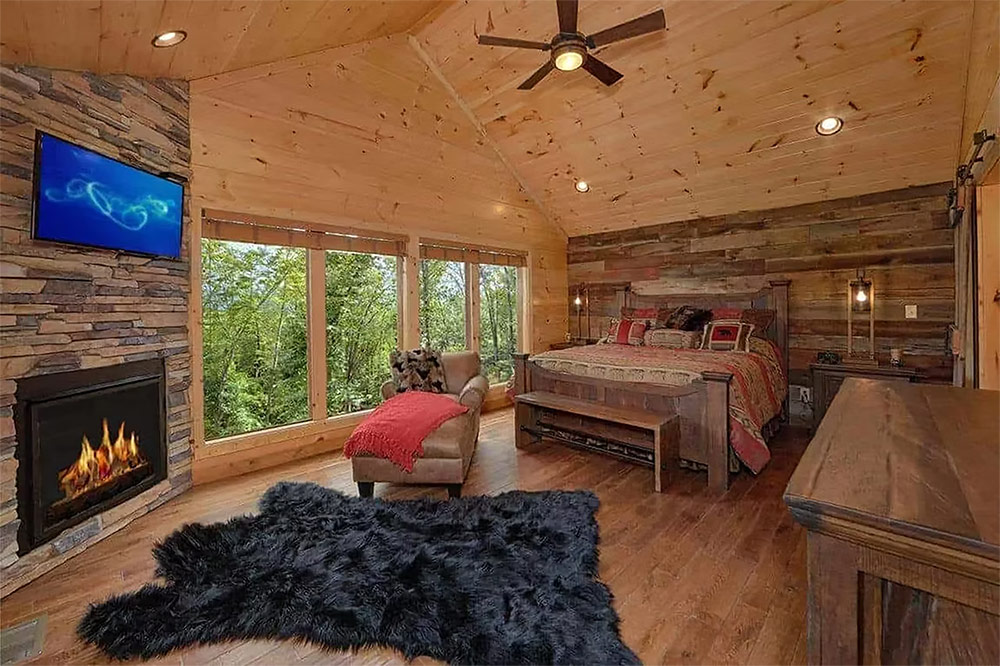 Bedroom suite with fireplace and large picture windows