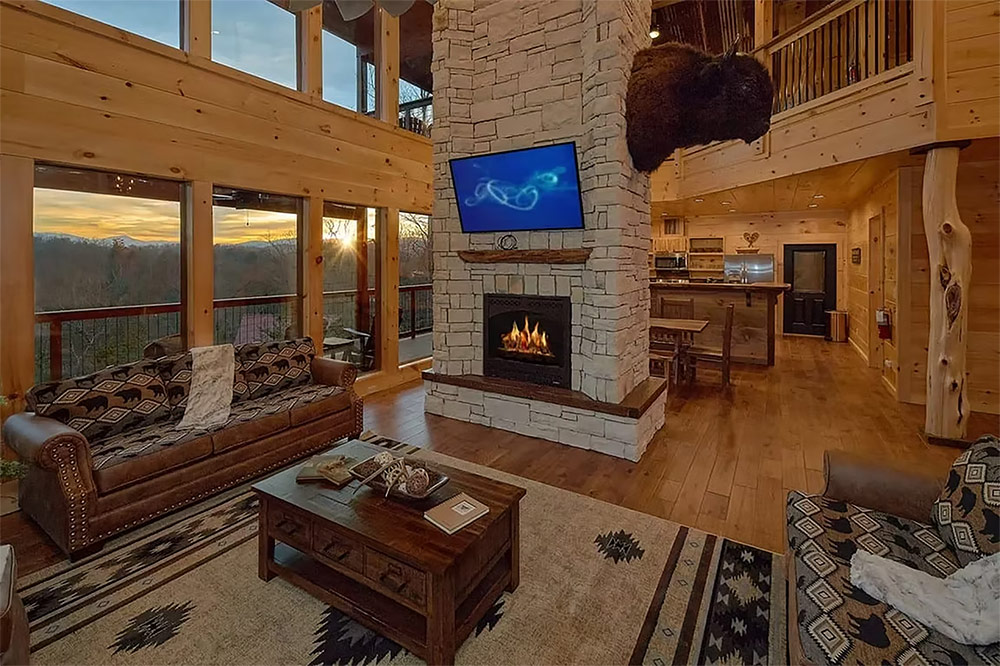 Open living space with fireplace and mountain cabin design