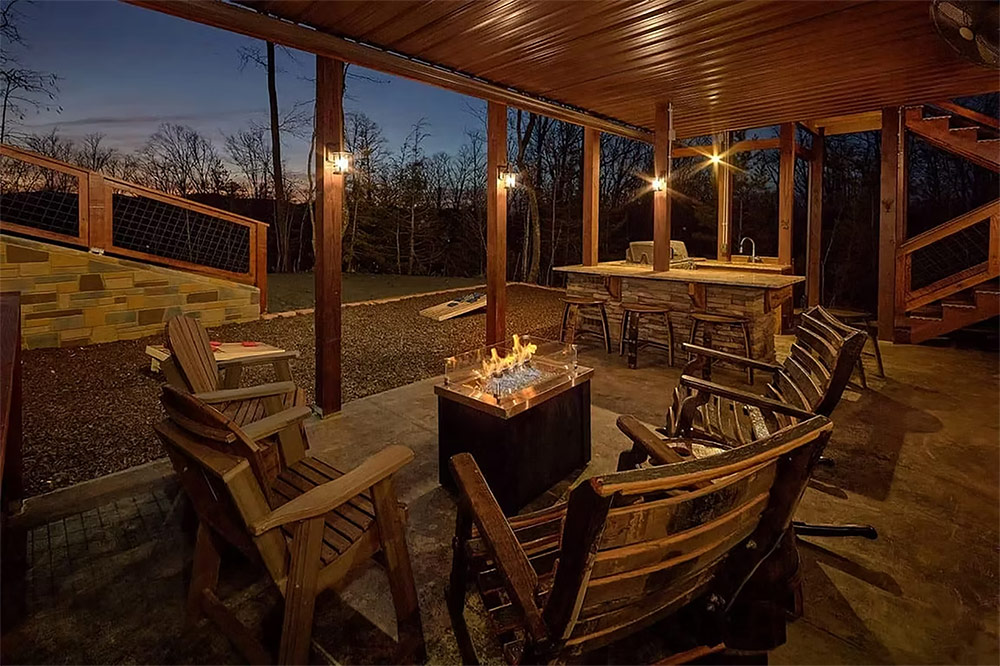 Outdoor dining area with fire table overlooking the Smoky Mountains