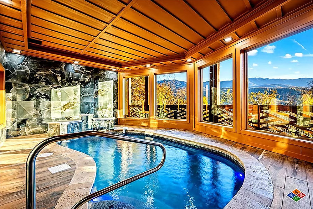 Indoor heated swimming pool with mountain views