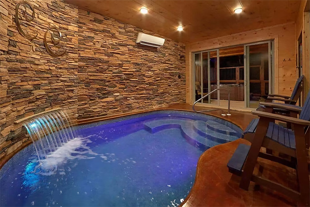 Indoor spa pool with stone accent walls