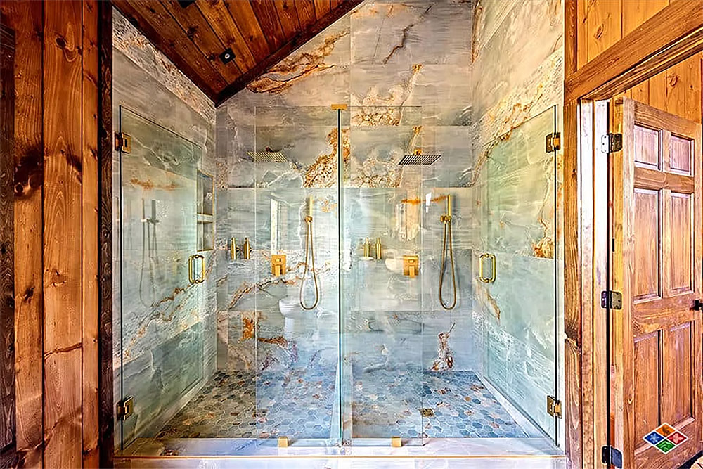 Luxury walk-in tile shower with frameless glass enclosure