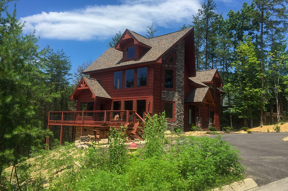 Custom Smoky Mountain home with spacious decks and wooded setting