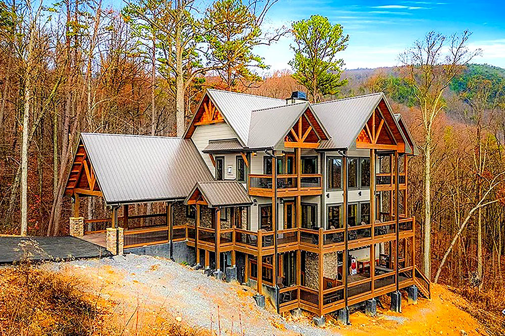 Large luxury cabin with expansive windows and mountain views in Sevier County